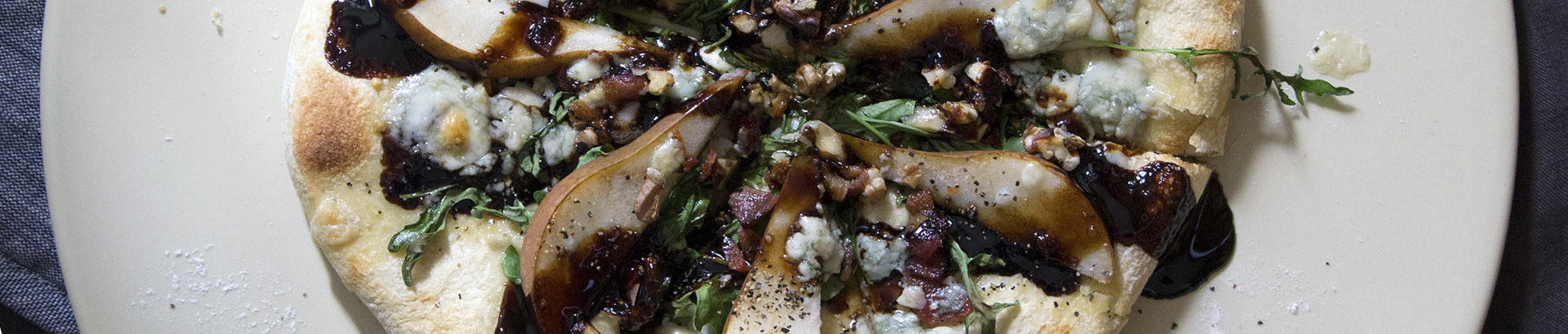 Bosc Pear Bacon Gorgonzola Pizza with Arugula, Walnuts & Balsamic